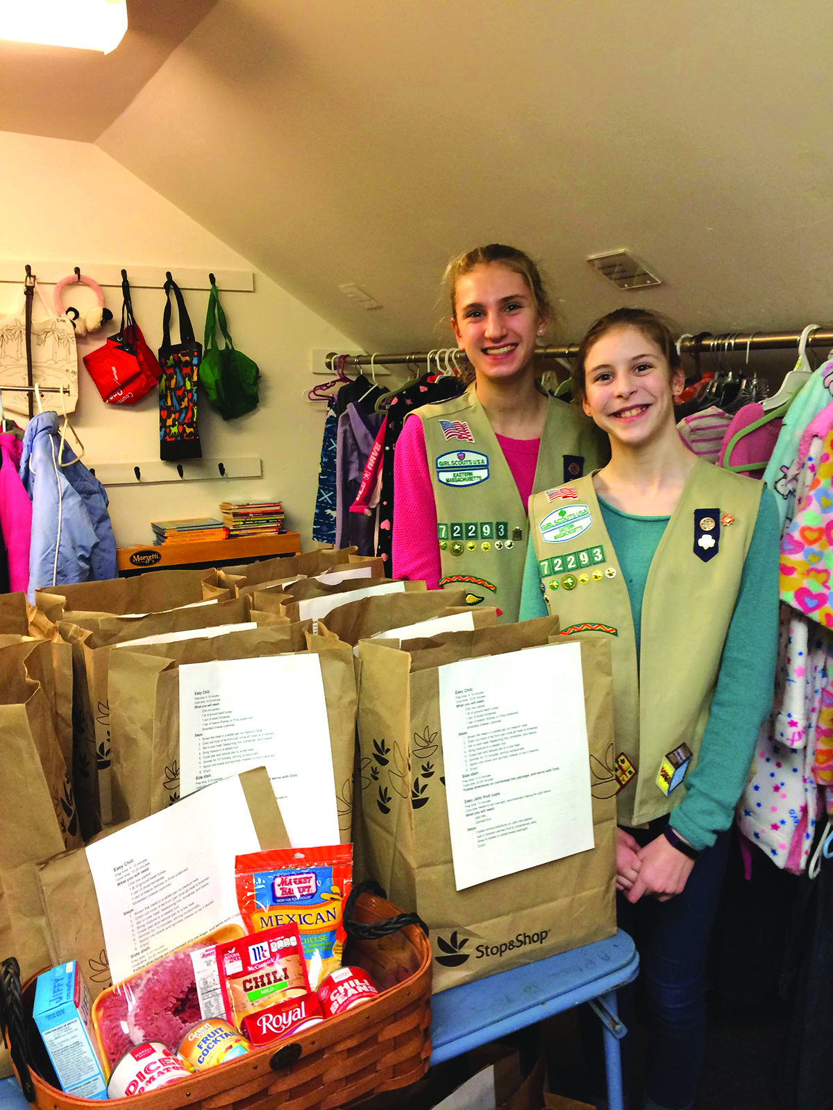 Emily Arthur and Mary Dougherty of Natick Cadette Girl Scouts Troop 72293 at “A Place to Turn” food pantry in Natick.