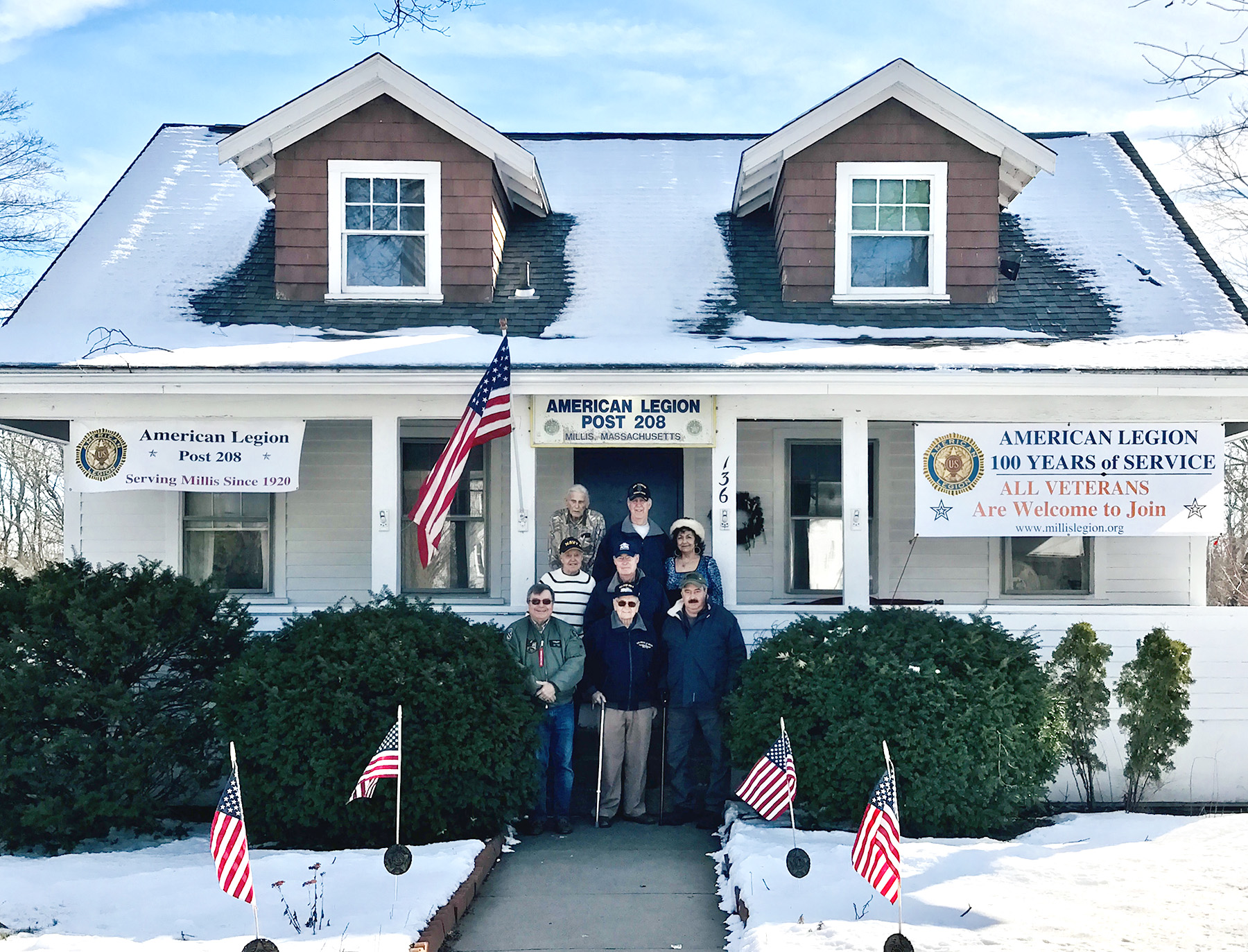 Millis American Legion Post 208 is celebrating its centennial year. Congress now allows ALL veterans to become Legionnaires, whether they served during wartime or peacetime. Shown, L-R, top row, Bud Waite, Larry McCarter; middle row, Harold Crosby, Tom Howie, Mary Ann Sheridan; bottom row, Bob Yeager, Wayne Hanson, and Mark Slayton.