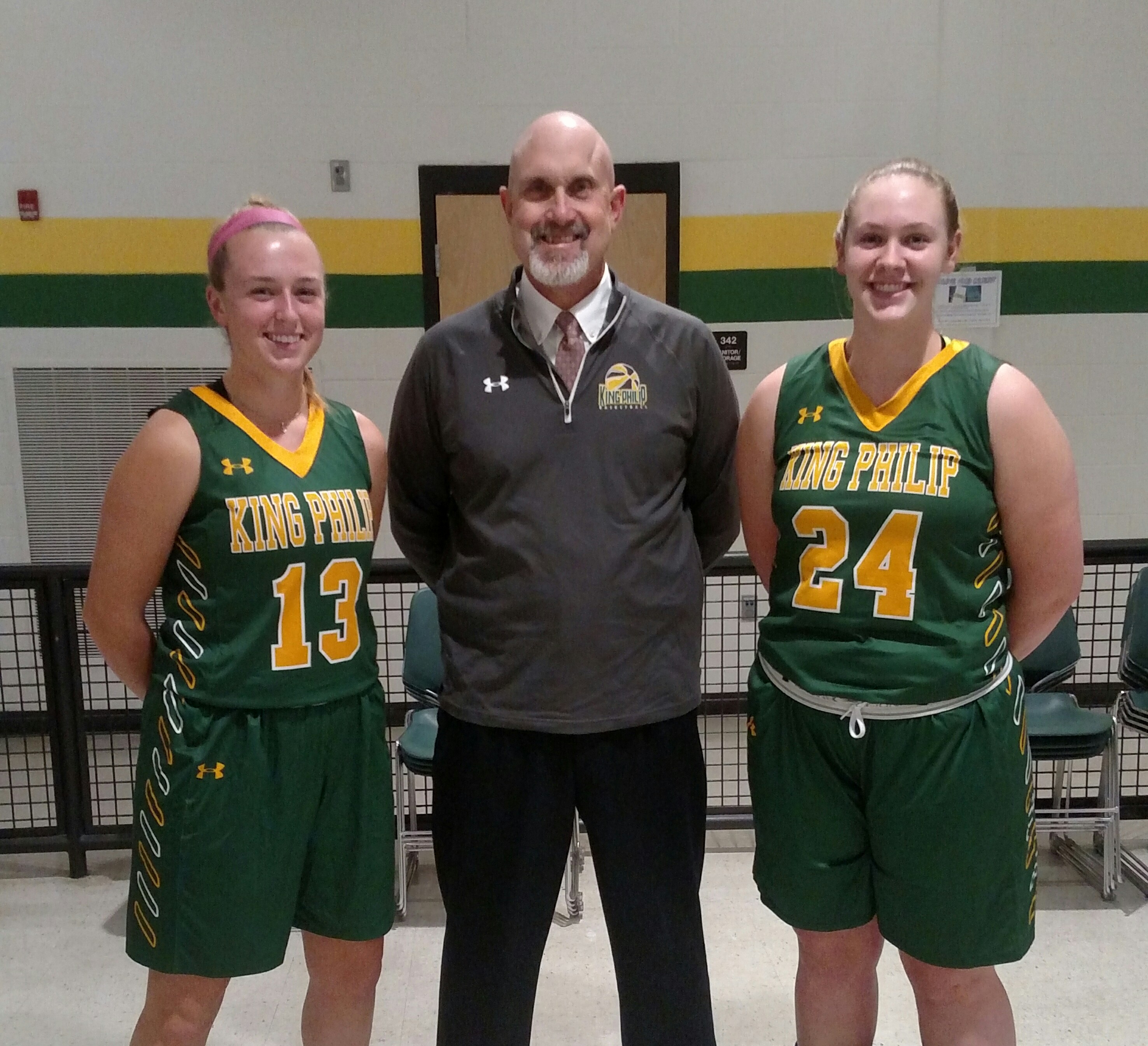 King Philip coach Marty Crowley with his captains--Christina Hathaway, left, and Courtney Kelleher.