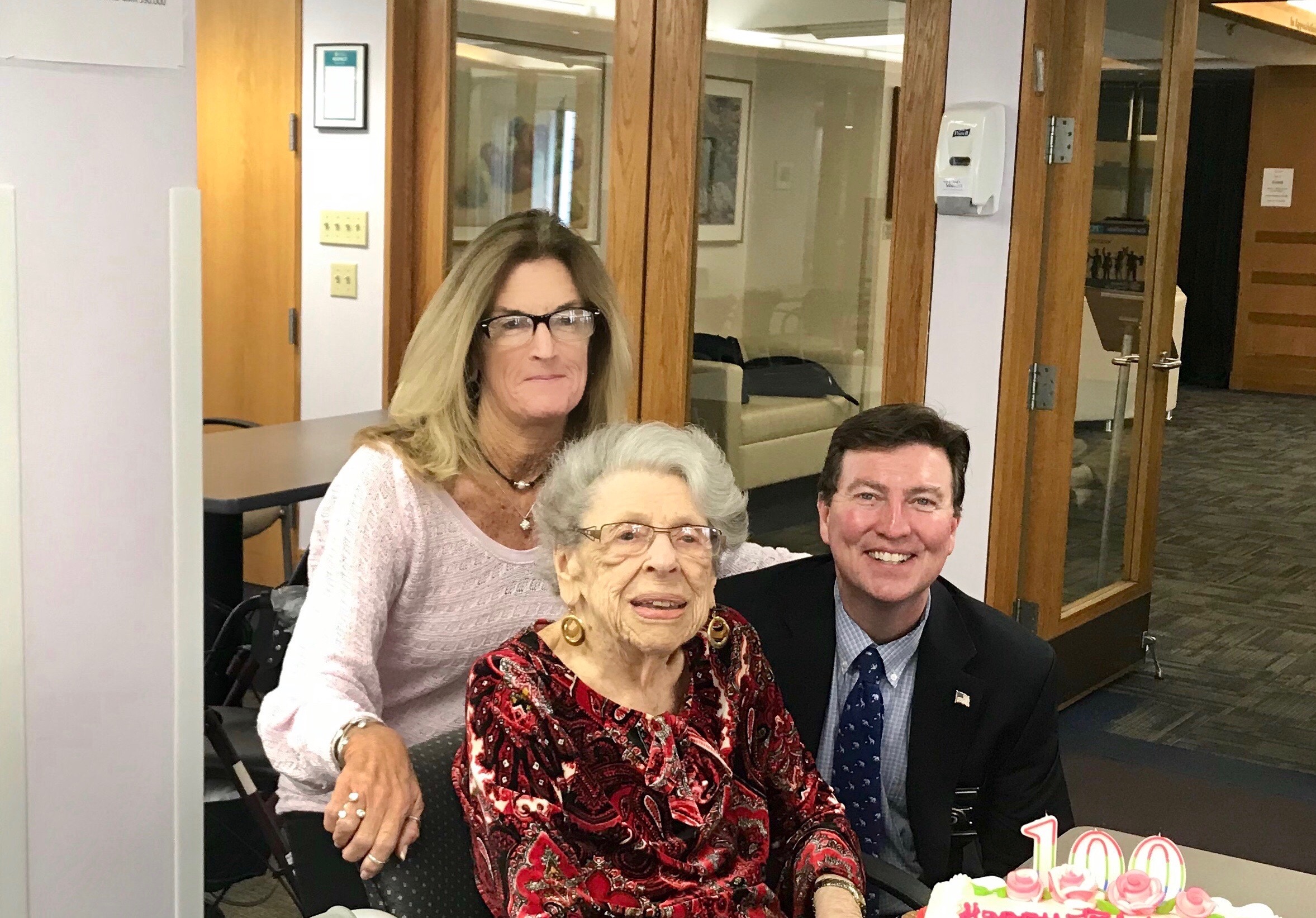 101-year-old Rose Less, of Randolph, has been enrolled in “Are You Ok?”, a program of the Norfolk County Sheriff’s Office, for many years. This free daily phone call checks on seniors and disabled citizens living alone in Norfolk County. From left, Cheryl Bambery, Deputy Sheriff/TRIAD Officer, Rose Less, and Norfolk County Sheriff Jerome McDermott.